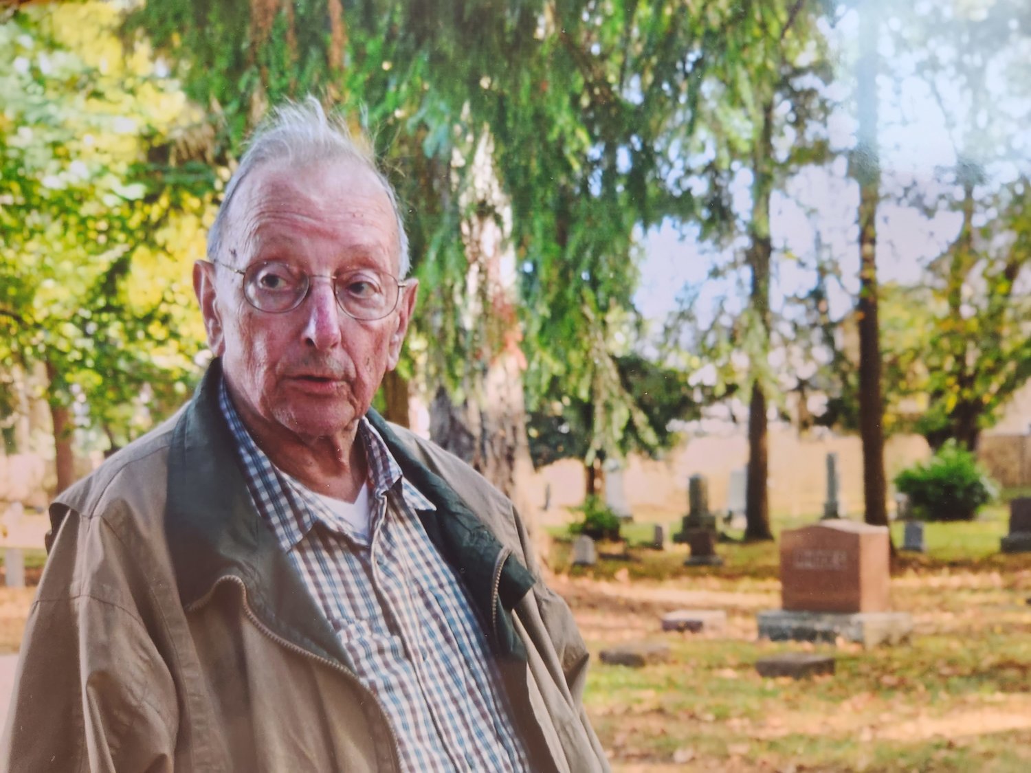 Larry Mills is pictured at the Grand Mound Cemetery in this photograph from Greg Isaacson.